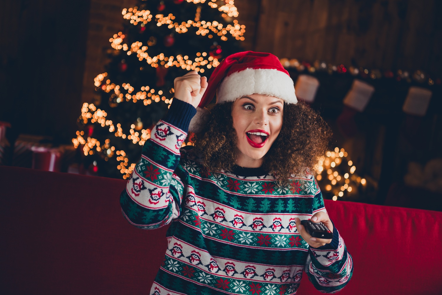 Woman watching tv at Christmas